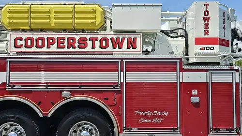 Upper body side close-up showing raised lettering beneath ladder beam