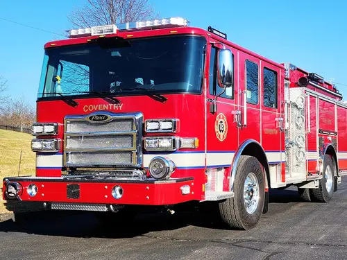 Pumper front-left exterior view showing grille, bumper, and cab