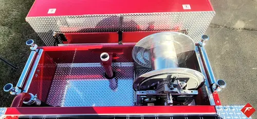 Top deck close-up showing monitor piping and hosebed hardware
