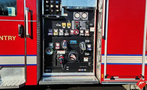 Pump panel close-up showing gauges, valves, and intake controls