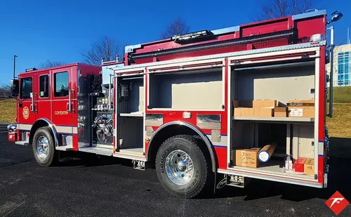 Driver-side profile with open lower compartment showing shelf storage