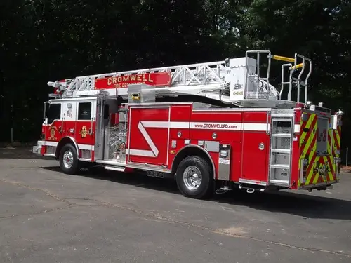 Rear-right exterior view showing side ladder bed and rear wheel area