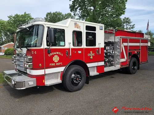 Pumper front-left exterior view showing enclosed cab and side compartments