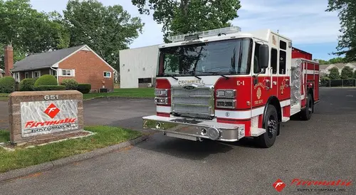 Front-left exterior view showing bumper, cab, and side body
