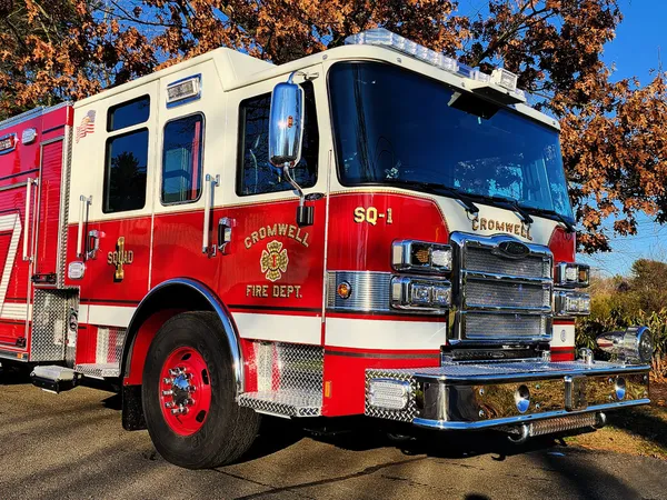 Rescue pumper front-left exterior view showing grille, bumper, and cab