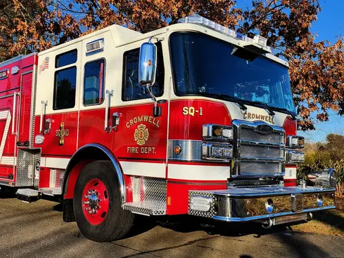 Rescue pumper front-left exterior view showing grille, bumper, and cab