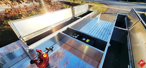 Top deck view showing hosebed grating, mounted fittings, and nozzle hardware