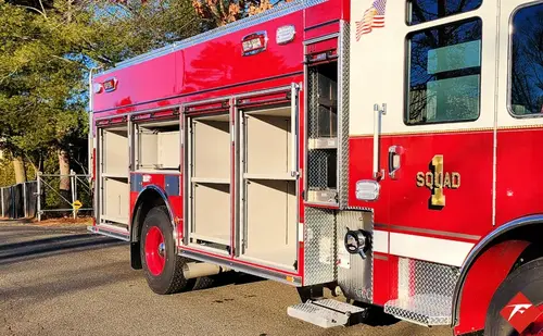 Officer-side rear profile showing rescue body and side roll-up doors