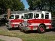 Two-apparatus front-quarter lineup view showing grilles and bumpers