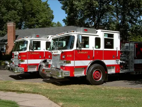 Two-apparatus front-quarter lineup view showing grilles and bumpers