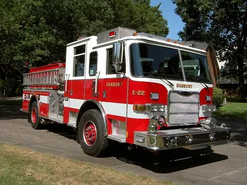 Front-left exterior view showing bumper, cab, and side body