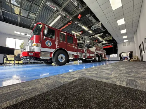 Danbury Pierce Enforcer 100-foot aerial tower front-left view inside the apparatus bay