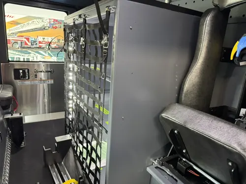 Danbury Pierce Enforcer 100-foot aerial tower cab storage rack detail