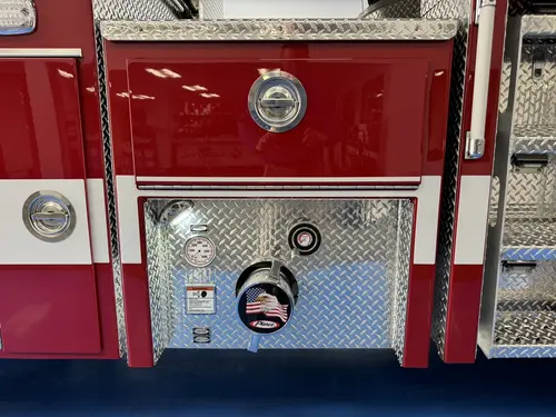 Danbury Pierce Enforcer 100-foot aerial tower front bumper intake and connection panel