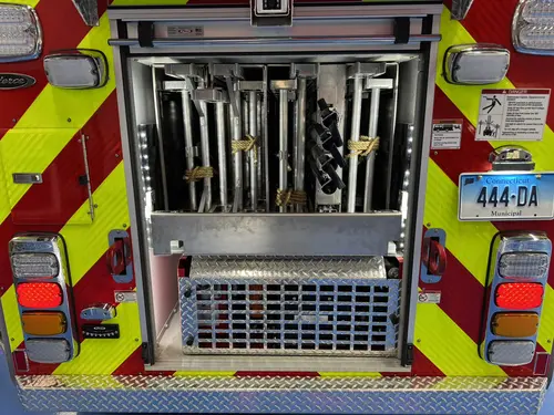 Danbury Pierce Enforcer 100-foot aerial tower rear view with aerial base and chevron striping