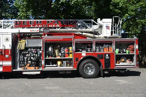 Driver-side profile showing open compartments along full body length