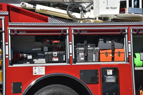 Mid-body compartment close-up showing open storage bays and mounted gear