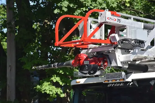 Ladder tip section close-up showing red bucket framework and ladder hardware