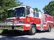 Wide front-left thumbnail view of the rescue pumper parked roadside.