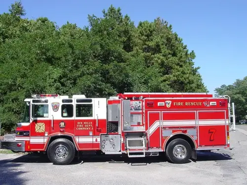 Driver-side full profile showing side compartments, pump controls, and full wheelbase.