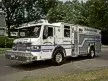 Front-left exterior view showing bumper, cab, and side body compartments