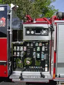 Front exterior view showing grille, bumper, and warning lights