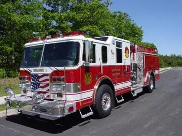 Pumper front-left exterior view showing cab, grille, and side body