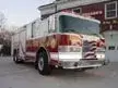 Front-left exterior view showing bumper, cab, and side compartments