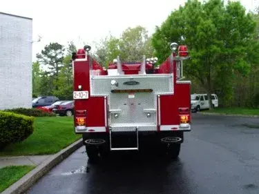 Rear view showing rear panel, warning lights, and lower step