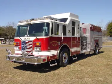 Pumper front-left exterior view showing commercial-style cab and side compartments