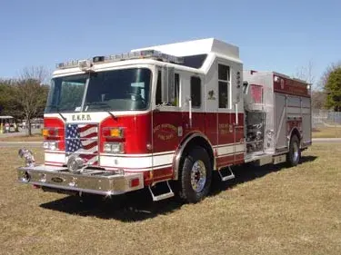 Pumper front-left exterior view showing commercial-style cab and side compartments
