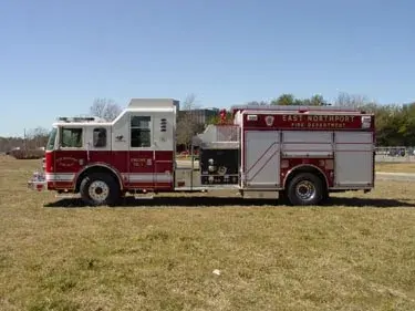 Driver-side profile showing pump panel area and side body compartments