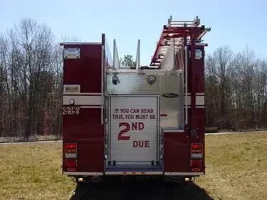 Rear view showing rear panel, warning lights, and hosebed divider fins