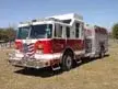 Pumper front-left exterior view showing commercial-style cab and side compartments