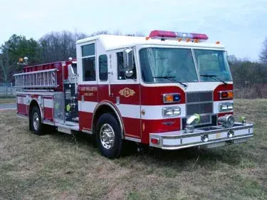 Front-left exterior view showing bumper, grille, and side body