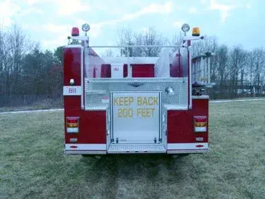 Rear view showing rear body panel, warning lights, and hosebed area