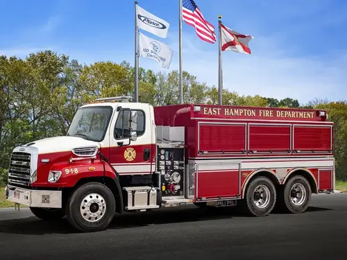 Pierce rescue pumper driver-side profile with side compartments and pump panel controls