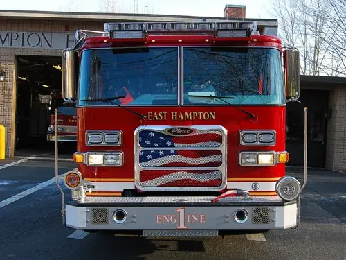 Front exterior view showing grille, bumper, and warning lights