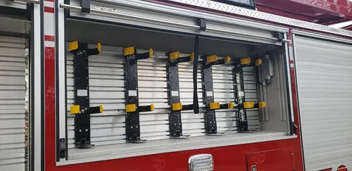 Open side compartment showing mounted hose and fittings in rack