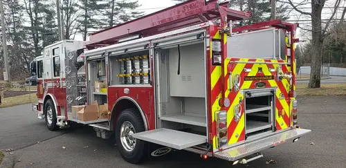 Rear-right exterior view showing side compartments and rear chevron panel