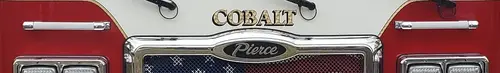 Front grille close-up showing Cobalt nameplate on red trim panel