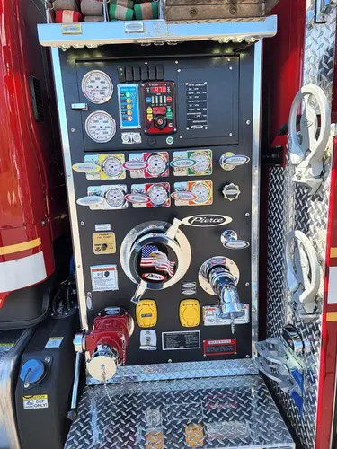 Pump control panel close-up showing gauges, valves, and intake controls