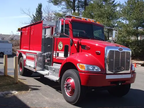 Tanker front-left exterior view showing commercial-style cab and long tank body