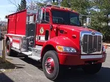 Tanker front-left exterior view showing commercial-style cab and long tank body