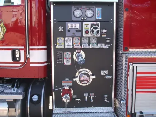 Pump panel close-up showing gauges, valves, and intake controls