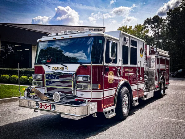 Pumper front-left exterior view showing grille, bumper, and side body