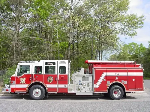 Driver-side profile view showing side compartments and pump panel area