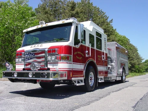 Low front-left exterior view showing grille, bumper, and cab