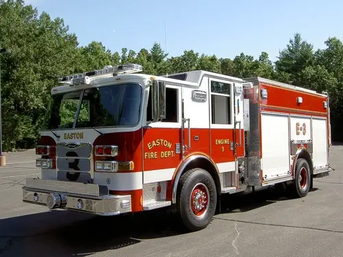 Pumper front-left exterior view showing enclosed cab and side compartments