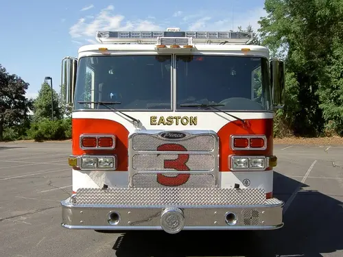Front exterior view showing grille, bumper, and warning lights